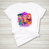 White t-shirt with colorful cartoon characters on a wooden surface anime idol style streetwear tee