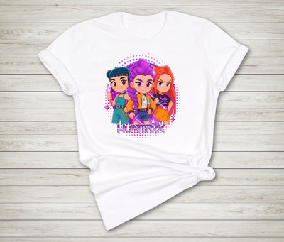 White t-shirt with colorful cartoon characters on a wooden surface anime idol style streetwear tee