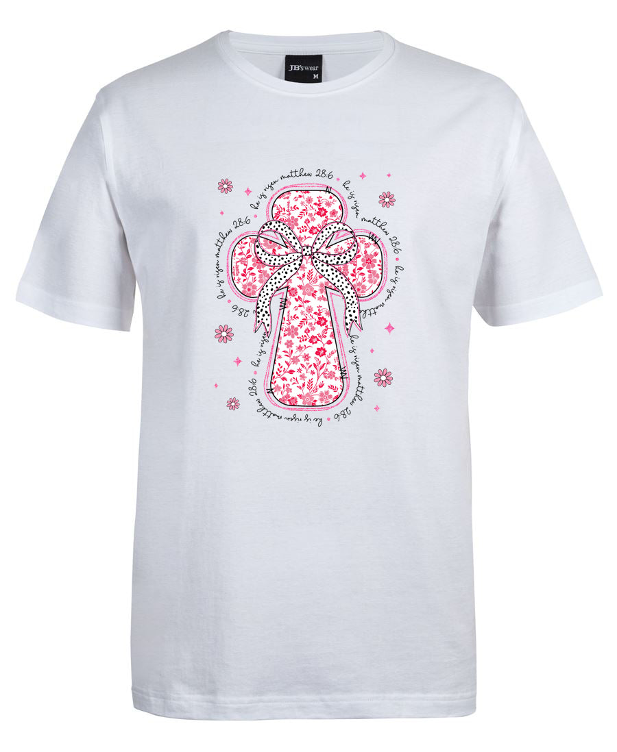 White t-shirt with a pink floral cross design on a white background