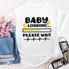 White maternity t-shirt with “Baby Loading” progress bar graphic, perfect for pregnancy reveal moments.