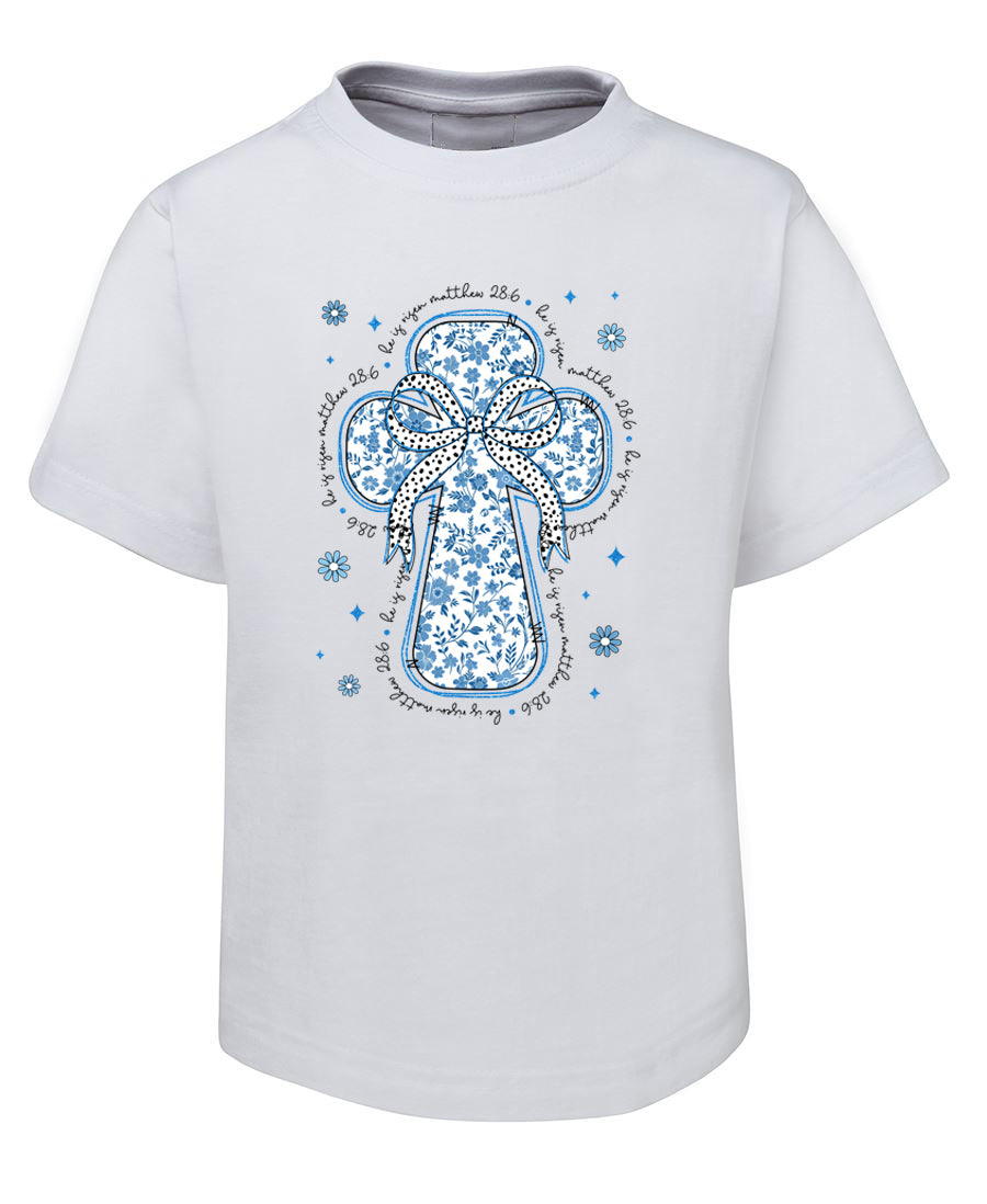 White t-shirt with blue floral cross design on a white background