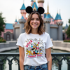 Flat lay of Castle Crew family trip t-shirt with cartoon castle and bold lettering.