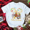 Festive Disney-inspired Christmas shirt featuring snowy castle scene and gold sparkle Mickey ears