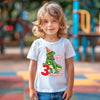 boy wearing dinosaucr birthday shirt