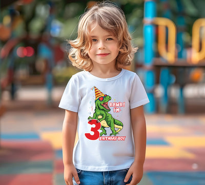 boy wearing dinosaucr birthday shirt