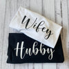 Couples matching shirts with Hubby and Wifey text for honeymoon or anniversary