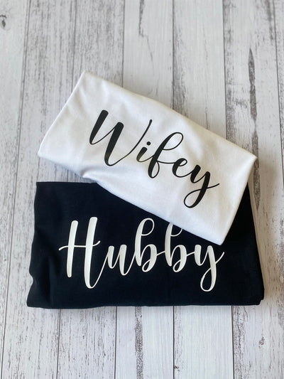 Couples matching shirts with Hubby and Wifey text for honeymoon or anniversary