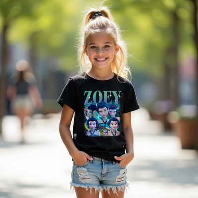 Young girl wearing a black t-shirt with a graphic design and text, standing outdoors.